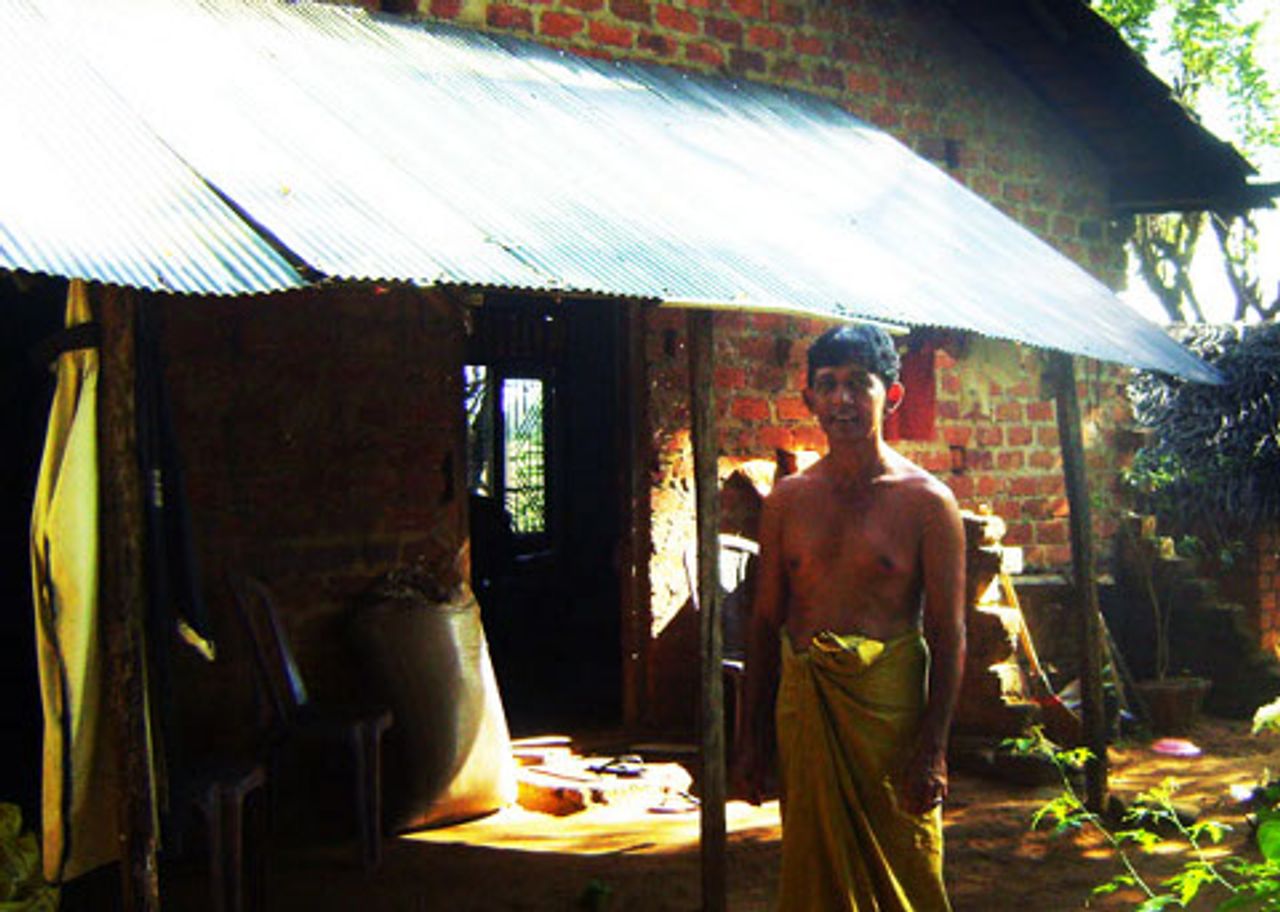 R.B Dharmathilaka outside his half-built home